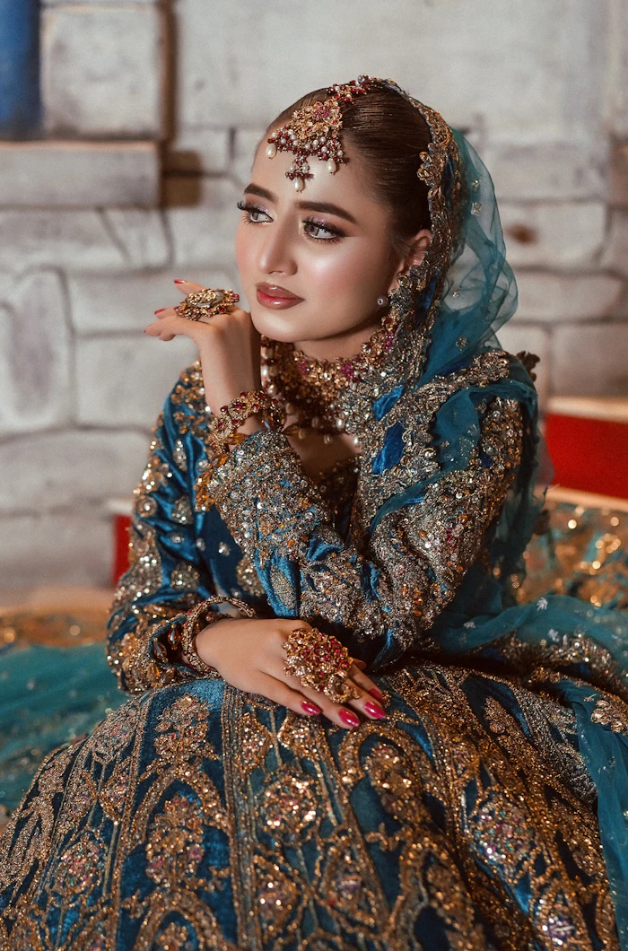 Formal look in teal and gold with a dupatta